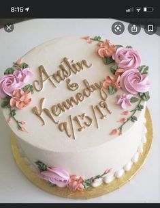 a wedding cake decorated with flowers and the words adam and nenady on it