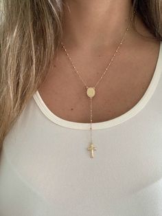 "This 14K yellow gold rosary necklace is the perfect religious symbol of faith. Featuring a cross pendant, shiny diamond cut 2.5mm round beads, and a 20\" chain, this necklace is a meaningful piece of Catholic jewelry. Its delicate design makes it an ideal gift for anniversaries, confirmations, 1st communion and other special occasions. ♦ Materials: 14K Solid Gold ♦ Available colors: Gold  ♦ Necklace measurements: 20\" total length, beads are 2.5MM ♦ Beads measurements: Beads are 2.5MM and diamo Personalized Spiritual Crucifix Necklace, Adjustable Crucifix Chain Jewelry, Yellow Gold Crucifix Necklace Spiritual, Spiritual Crucifix Cross Necklace For Jewelry Making, Spiritual Yellow Gold Crucifix Necklace, Personalized Spiritual Crucifix Jewelry, Gold Cross Rosary In Spiritual Style, Yellow Gold Cross Rosary As Gift, Gold Crucifix Rosary For Jewelry Making