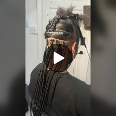 a woman with long braids in her hair