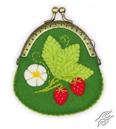 a green purse with strawberries and leaves on it