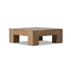 a square wooden table sitting on top of a white floor