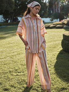 The Sunset Stripe Oversized Shirt is a classic boyfriend-style shirt and the perfect Summer throw on. Featuring an oversized style cut with short sleeves, a dropped shoulder and side splits. The oversized shirt can be worn as a shit or as a mini dress thrown over your favorite swimsuit. We recommend taking one size down from your usual swim size Model wears an XS/S FINAL SALE Striped Linen Pants, Linen Pants Women, Boyfriend Style, Oversized Style, Printed Linen, Striped Linen, Oversized Shirt, Linen Pants, Head Scarf