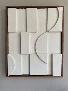 a painting on the wall with white paint