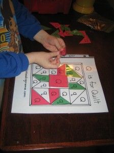 a child is playing with an origami puzzle on the table in front of them