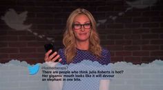 a woman holding a cell phone in front of a brick wall with the caption'there are people who think julia roberts is hot? her gigantic mouth looks like it will devour an elephant on one bite