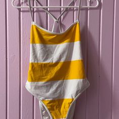 Never Worn Trendy White One-piece Swimwear, Trendy White Lined Swimwear, Trendy White Lined Bodysuit, Trendy White Bodysuit For Beach Season, Trendy White Bodysuit For Vacation, Trendy Stretch Swimwear For Day Out, Striped Beachwear Bodysuit For Spring, Spring Striped Beachwear Bodysuit, Spring Beachwear Striped Bodysuit