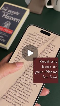 a person holding an iphone with the text read any book on your phone for free