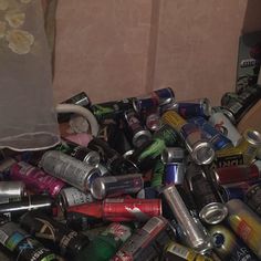 a pile of cans and cans sitting next to each other