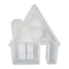 a white house shaped object on a white background