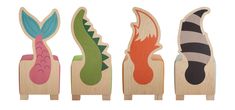 three wooden toys with different designs on them