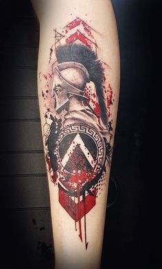 a man's leg with a red and black ink design on it, including an image of a soldier