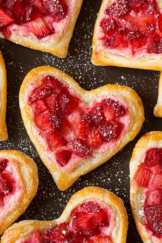 heart shaped pastries with strawberries on them