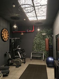 a home gym with exercise equipment and lights