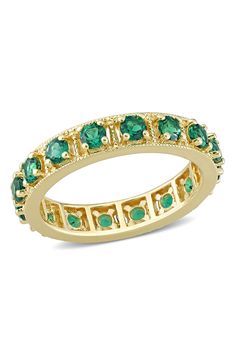 Prong-set lab-created emeralds glimmer from a golden ring, creating an eternity band that dazzles and awes. Total emerald weight: 1.44ct.   Goldtone plate/lab-created emerald   Imported Emerald Eternity Ring, Emerald Eternity Band, Lab Created Emerald, Women's Rings, Peoples Jewellers, Golden Ring, Plated Ring, Gold Plated Rings, Emerald Gemstone