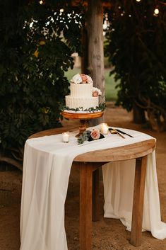 a table with a cake and candles on it