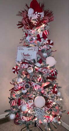 a christmas tree decorated with red and white ornaments