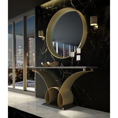 a black and gold bathroom with an oval mirror on the wall next to two sinks