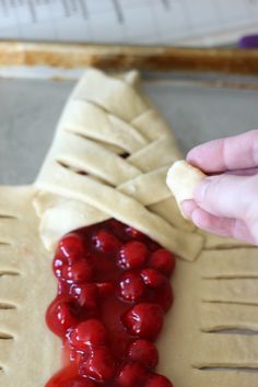 This delicious cherry-filled candy cane braided bread is drizzled with a sweet vanilla icing! It's the perfect treat for the holidays. Baked Dessert, Alphabet Cookies, Xmas Treats