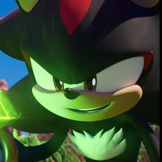 sonic the hedgehog from mario kart is holding a green object in his hand