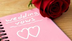 a pink notebook with the words wedding vows written on it next to a red rose