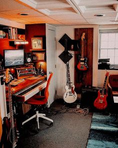 a room with guitars and other musical equipment