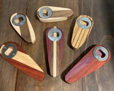 several wooden pieces with metal handles on a table