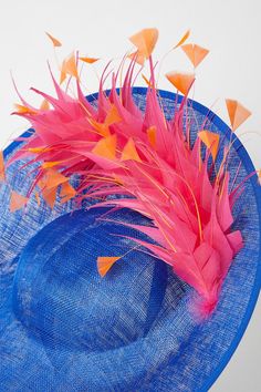 Striking contrast feather detail adorns this stylish hat Crafted from fancy fabric for an elegant look Structured side-facing design exudes sophistication Ideal for making a statement at formal occasions Complements Coast's occasion-wear collection perfectly Radiate confidence and poise at your next special event with this eye-catching hat from Coast. The vibrant feather detail adds a touch of drama, while the fancy fabric construction ensures a luxurious feel. Designed with a structured side-facing silhouette, this hat exudes sophistication and elegance. Pair it with a tailored dress or jumpsuit from Coast's occasion-wear collection for a refined and polished look that will turn heads at weddings, races, or any formal gathering. Fancy Fabric, Radiate Confidence, Fabric Construction, Stylish Hats, Tailored Dress, Polished Look, Hat Crafts, Formal Occasion, Special Event