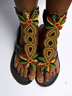 African beaded gladiator shoe Very beautiful and unique too Fully handmade Rasta sandals Bohemian T-strap Closed Toe Sandals For Festivals, Bohemian Closed Toe T-strap Sandals For Festivals, Traditional Multicolor Ankle Strap Sandals, Traditional Ankle Strap Sandals For Festival, Handmade Traditional Ankle Strap Sandals, Traditional Handmade Ankle Strap Sandals, Beaded Closed Toe Sandals For Festivals, Traditional Sandals With Adjustable Ankle Strap, African Shoes