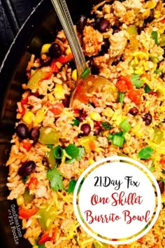 a close up of a plate of food with a spoon in it and the words 21 day fix one skillet burrito bowl