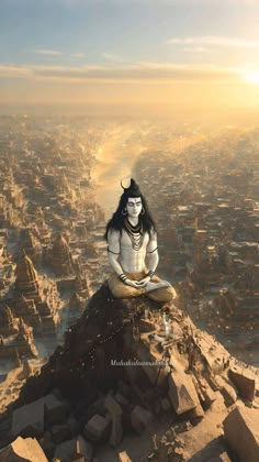 a man sitting on top of a pile of rocks