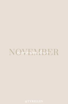 the word november written in white on a beige background