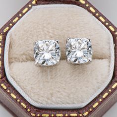 Earrings Information 
  


Metal: 
925 Sterling Silver 


SKU:
ACE-037/ACE-038 


Rhodium: 
Yes 


Nickle Free: 
Yes 


Gem Type: 
Moissanite


Stone Color: 
White


Stone Cut: 
Cushion Cut


Stone Total Weight:
1.0/2.0 CTTW.


Stone Setting:
Prong Setting


Average Clarity: 
FL-IF 


Average Color: 
D-E 



 




LOOKS THE SAME AS DIAMOND (WITH NAKED EYES)
While diamonds are graded on the 4 C’s scale (Cut, Clarity, Color, Carat), AINUOSHI Moissanite® are not diamond, and are graded solely on color. The cut and clarity are similar across different qualities.

Moissanite have higher dispersion and refractive index, and the result is that the fire color is better than diamonds. One good moissanite is almost perfect. AINUOSHI Moissanite® will bring you the best experience. Every AINUOSHI Mois Luxury Sterling Silver Brilliant Cut Earrings, Luxury White Moissanite Earrings, Luxury Moissanite Earrings With Prong Setting, Luxury Moissanite Diamond Earrings With Prong Setting, Luxury Classic Cushion Cut Diamond Earrings, Luxury Sterling Silver Earrings With Stone Setting, Luxury Sterling Silver Diamond Cut Gemstones, Luxury White Moissanite Diamond Earrings, Luxury Brilliant Cushion Cut Earrings