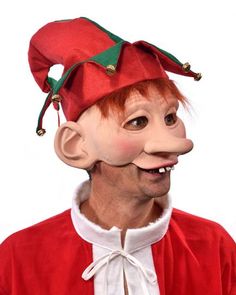 a man wearing a red elf hat with bells on it's head and nose