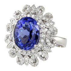 Stamped: 14K White GoldTotal Ring Weight: 8.5 GramsRing Length: N/ARing Width: N/AGemstone Weight: Total Natural Tanzanite Weight is 5.97 Carat (Measures: 12.00x9.60 mm)Color: BlueDiamond Weight: Total Natural Diamond Weight is 1.00 CaratColor: F-G, Clarity: VS2-SI1Face Measures: 22.55x19.95 mmSku: [704102W] 14k White Gold Diamond Ring, Tanzanite Diamond Ring, Purple Sapphire, Gold Diamond Ring, Hrithik Roshan, White Gold Diamond Rings, Natural Tanzanite, White Gold Diamonds, Sapphire Ring