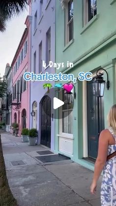 a woman is walking down the sidewalk in charleston, sc with pink and blue buildings behind her