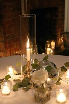 a table with candles and flowers on it