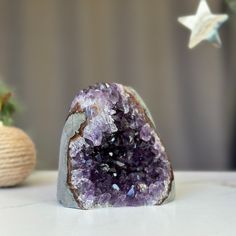 This is a unique Amethyst with unusual druzy cave formations on one side. The stone you will receive is the exact one as in the picture. ✧ MEASURES: Width: 3.5 in x Height: 4 in. Weight 1.8 lb (841 gr) Amethyst Geodes Gemstone Gift, Large Amethyst Geodes As Gifts, Large Amethyst Geode Stone As A Gift, Large Amethyst Geode As Gift, Amethyst Geodes Raw Stone As Gift, Amethyst Raw Stone Geodes As Gifts, Amethyst Geode Raw Stone Gift, Unique Amethyst Geodes As Gift, Purple Large Stone Geode As Gift