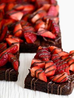 chocolate cake topped with strawberries and drizzled with chocolate