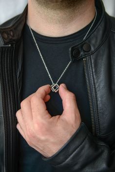 Add a touch of sophistication and style to your look with our Silver Cube Necklaces for Men. Crafted with high-quality stainless steel, these necklaces are built to last and withstand daily wear. The waterproof design ensures durability, making it suitable for any occasion. The pendant features a sleek and modern round coin design, measuring 13.5mm x 13.5mm. Its compact size adds a subtle statement to your outfit without overpowering your style. The silver color adds a touch of elegance and vers Necklaces For Men, Cube Necklace, Coin Design, Magical Jewelry, Message Jewelry, Necklace For Men, Modern Round, Star Necklace, Men Necklace