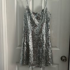 Sequin Silver Dress. Adjustable Straps. Never Been Worn. Zipper On Side Measurements : Armpit To Bottom - 23 1/2 Inches Underbust - 14 Inches Waist - 18 Inches Sequin Silver Dress, Silver Sequin Dress, Urban Dresses, Urban Outfitters Dress, Silver Dress, Urban Outfitters, Adjustable Straps, Colorful Dresses, Sequin