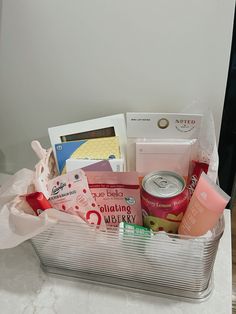 a silver basket filled with lots of different items