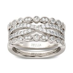 You'll love the elegant and charming look of this crossover band set. Crafted in sterling silver, the center band features two ribbons arranged in a striking crossover pattern. Completing this unique pair, the outer bands feature dainty round stones in alternating round and marquise-shaped frames lined with intricate milgrain detailing. Wear one, two or all three of these stylish band for any occasion. Carat Weight: 1.285 ctStone Size: 1,1.4,1.5 mmStone Type: Jeulia® StoneNumber of Stones: 61 Stone Color: Diamond WhiteStone Shape: RoundWeight: 9.31 gWidth: 4.5 mmHeight: 2.7 mmThickness: 6.5 mmMaterial: 925 SilverPlating Color: Silver 25 Year Anniversary, Stunning Diamond Rings, Jewelry Knowledge, Ruby And Sapphire, Pear Cut Engagement Rings, Wedding Rings Round, Sterling Silver Promise Rings, Jewelry Fashion Trends, Silver Engagement Rings