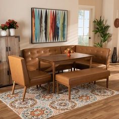 a living room with a couch, table and chairs