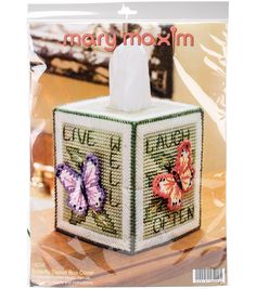 a cross stitch tissue box with two butterflies on it