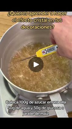 a person using a thermometer to measure food in a pan on a stove