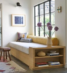 a living room filled with furniture and a window