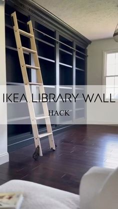 there is a ladder in the middle of a room with bookshelves on it