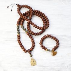 Mala Beads Energizing Bodhi Seed Mala & Bracelet Set Gold Mala With 108 Beads For Meditation, Brown Hand-knotted Mala As Gift, Handmade Gold Spiritual Mala, Traditional Hand-wrapped Bracelets For Meditation, Traditional Hand-strung Bracelets For Meditation, Adjustable Spiritual Hand-strung Mala, Thai Buddha, Good Luck Charms, Hand-strung Amulet Mala For Meditation