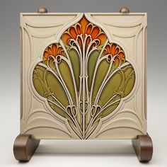 an art deco style cabinet with wooden wheels and handles, painted in gold and orange