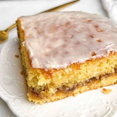 a close up of a piece of cake on a plate with a fork and knife